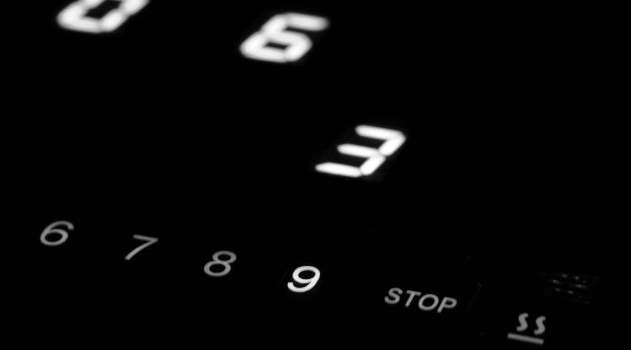 Close-up of a CERAN EXCITE® cooktop showing illuminated numbers