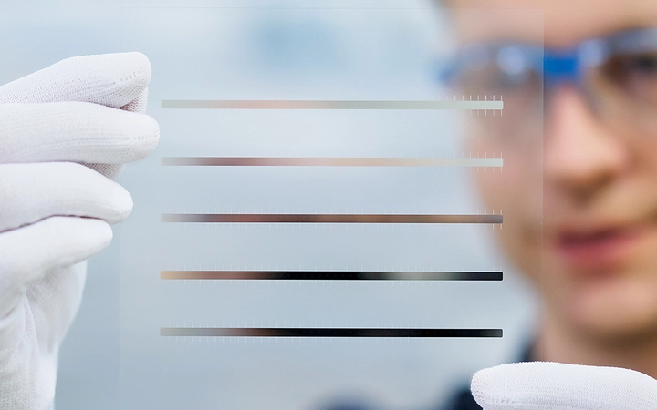 Expert inspecting glass wafer with conductive structures