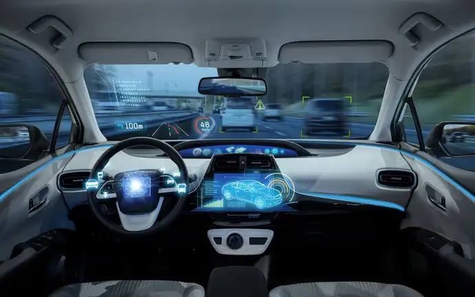 Car interior with digital dashboard and heads-up display.