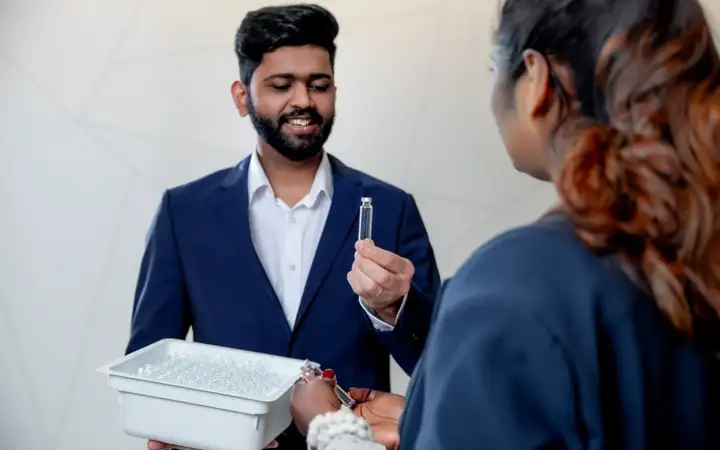 Man showing safepack cartridges to a patient