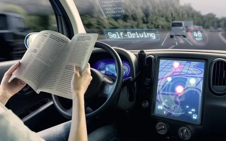 Passenger reading a book in an autonomous vehicle