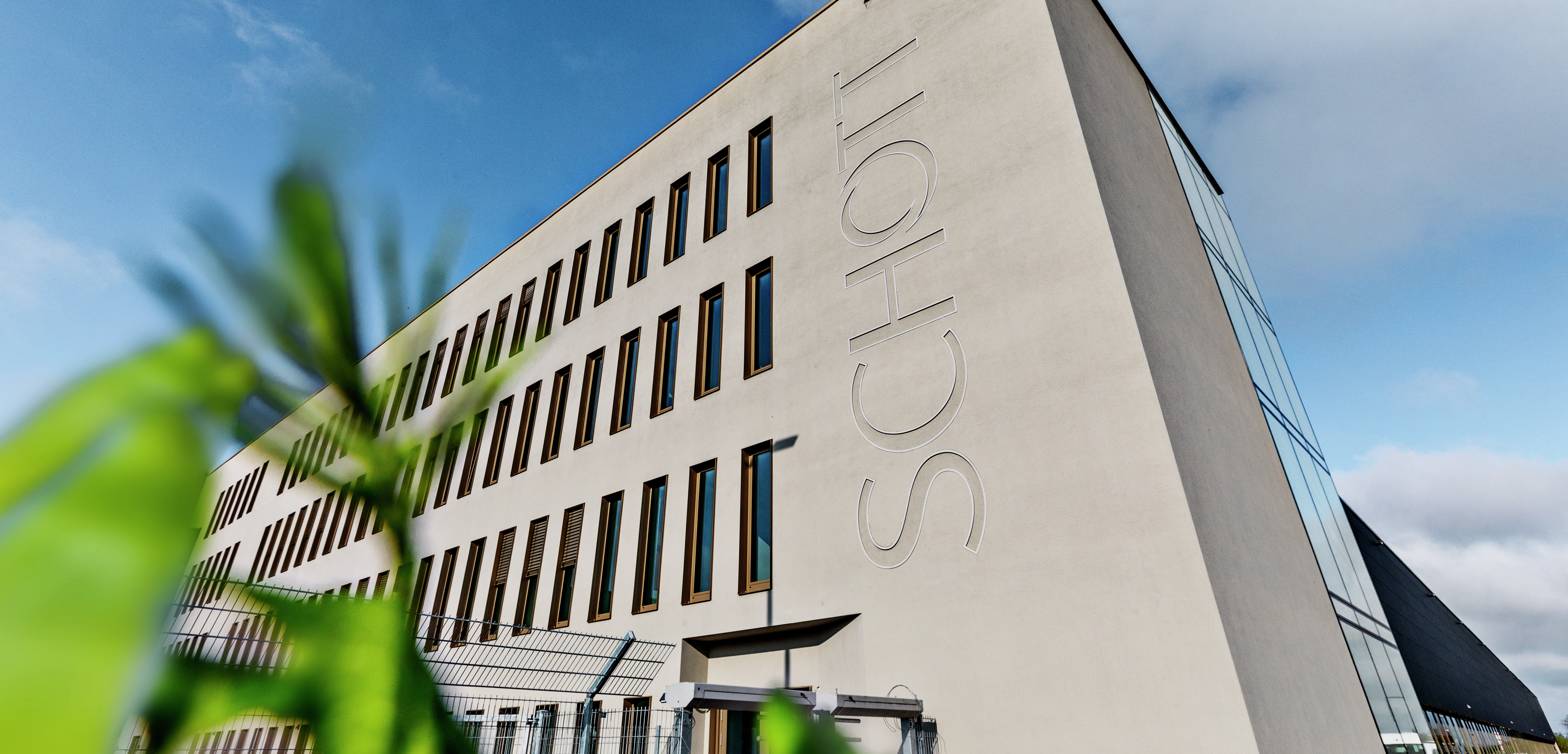 SCHOTT Pharma building in Müllheim with trees