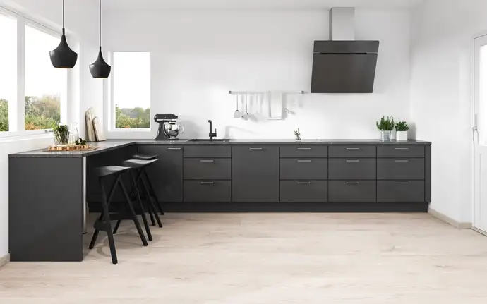 Modern kitchen with white cabinetry, stainless steel appliances, and a black glass extractor hood. Includes a double-glass door fridge,  built-in oven and microwave, and a bowl of fruit on the counter