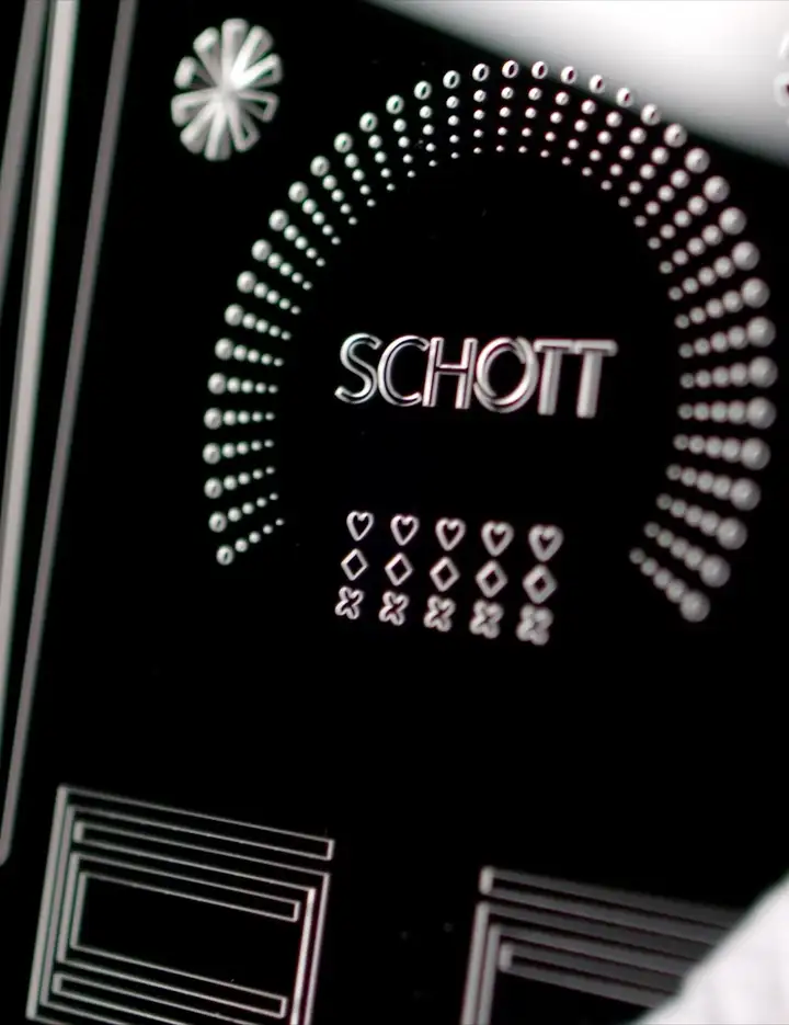 SCHOTT FLEXINITY® structured glass wafer on a black background