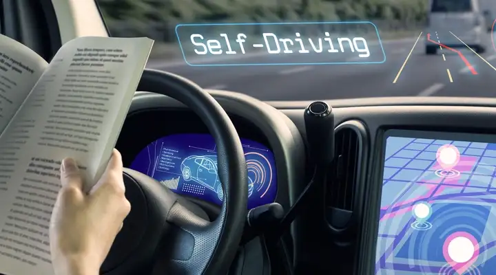 Passenger reading a book in an autonomous vehicle