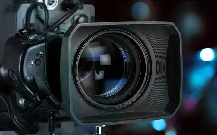 Close up of a camera lens with black surround