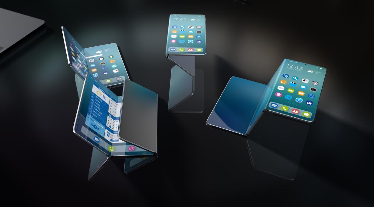 Four foldable smartphones on a dark background