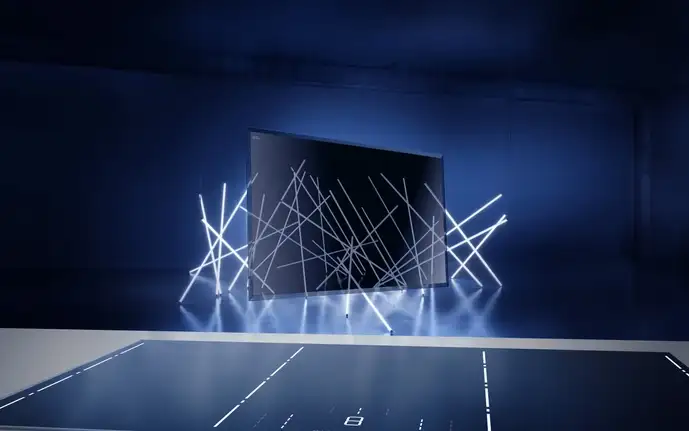 Luminoir® Kochfläche sowie eine Luminoir® Glaskeramik schwebt im Raum vor einer Lichtinstallation, die hindurchscheint.