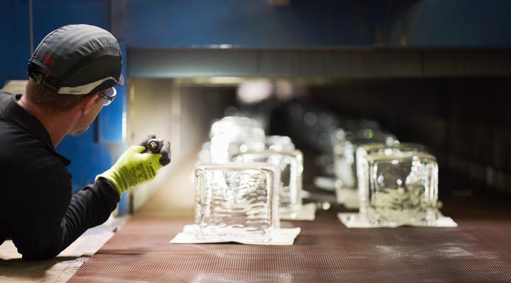 Man at production line with glass blocks