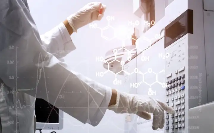 Scientist operating laboratory equipment