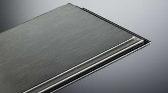 Close-up view of a glass panel with a brushed finish and a folded edge, set against a gradient gray background.