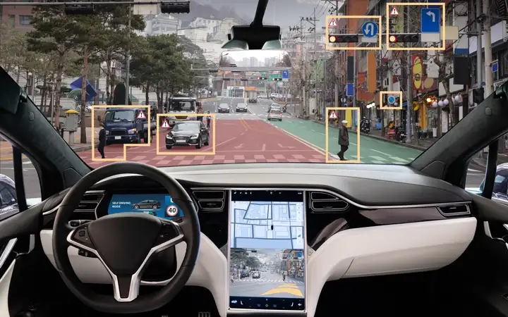 Interior of an autonomous vehicle with display of the road ahead