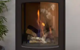 Fireplace with roaring fire comparing a ROBAX® TrueView panel and uncoated ROBAX® panel