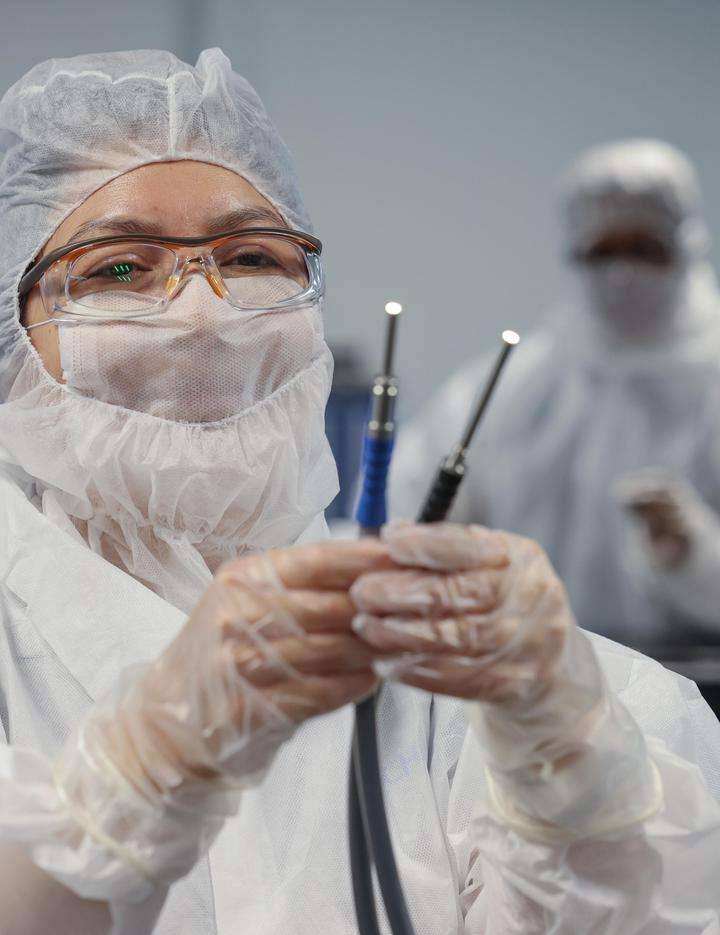 Two workers manufacturing lighting products in the cleanroom in Mexico