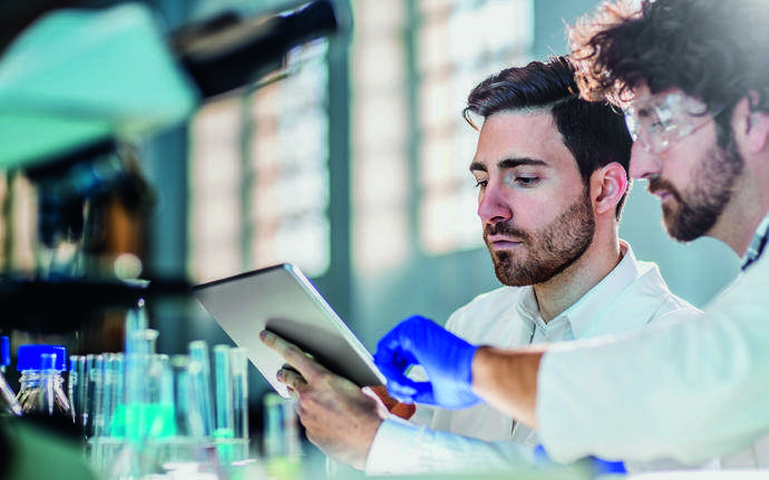 Scientist looking at a tablet computer in a laboratory