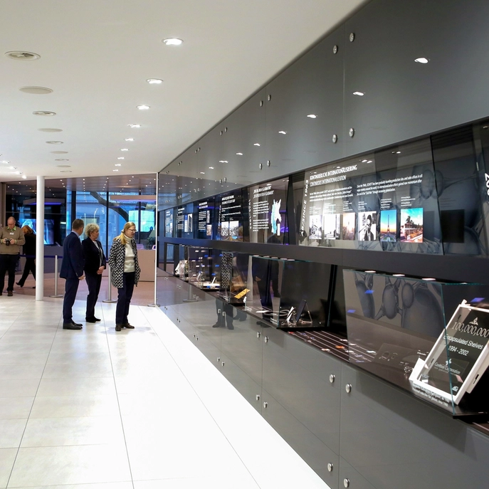 Modern exhibition with interactive displays and visitors