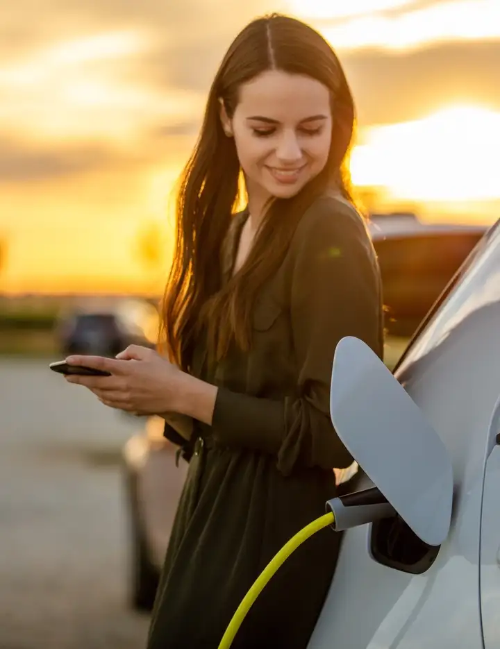 A person charging her car.