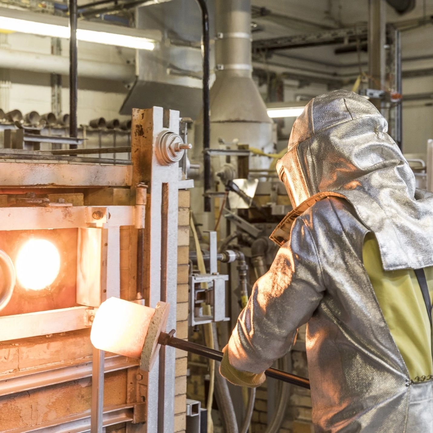 Glass melter works in front of the melting oven