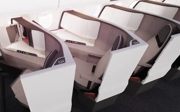 Business class airplane seats with privacy panels and soft lighting