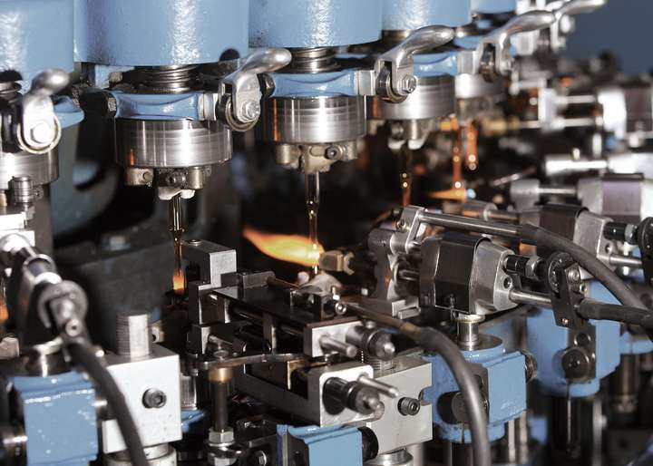 Close up of glass processing equipment producing ampoules