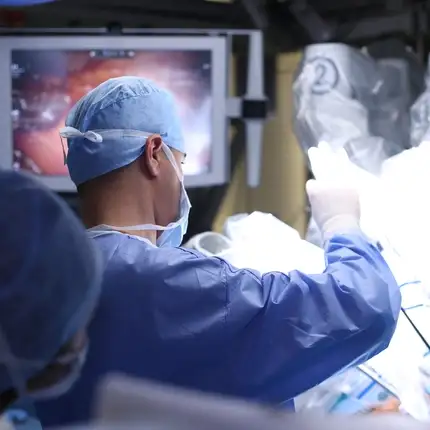 A surgeon performing a procedure with high-precision medical devices