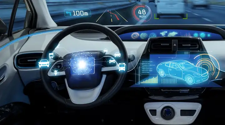 Interior of a vehicle showing the dashboard outlined in blue contour light