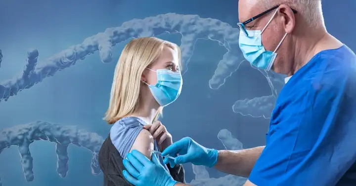 Woman getting an injection from a doctor via syringe.