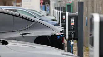 Electric cars lined up at charging stations on the SCHOTT premises