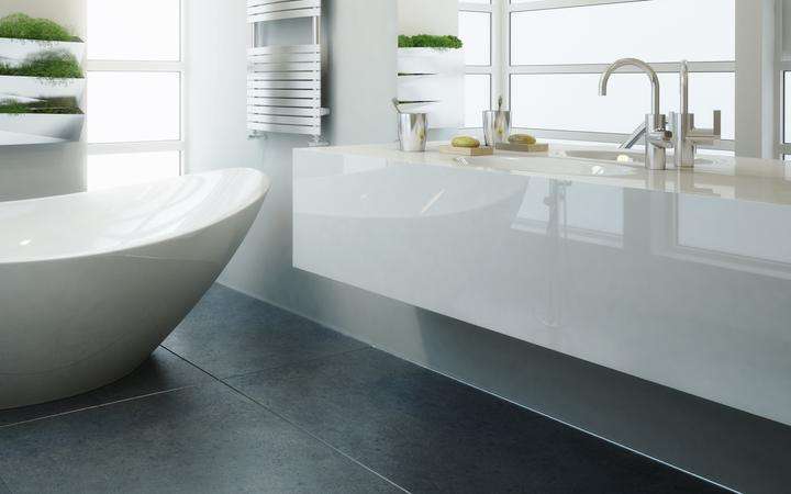 White modern bathroom with free-standing bath
