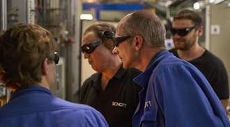 Michael Hahn and three colleagues monitor the melting process protected by safety goggles