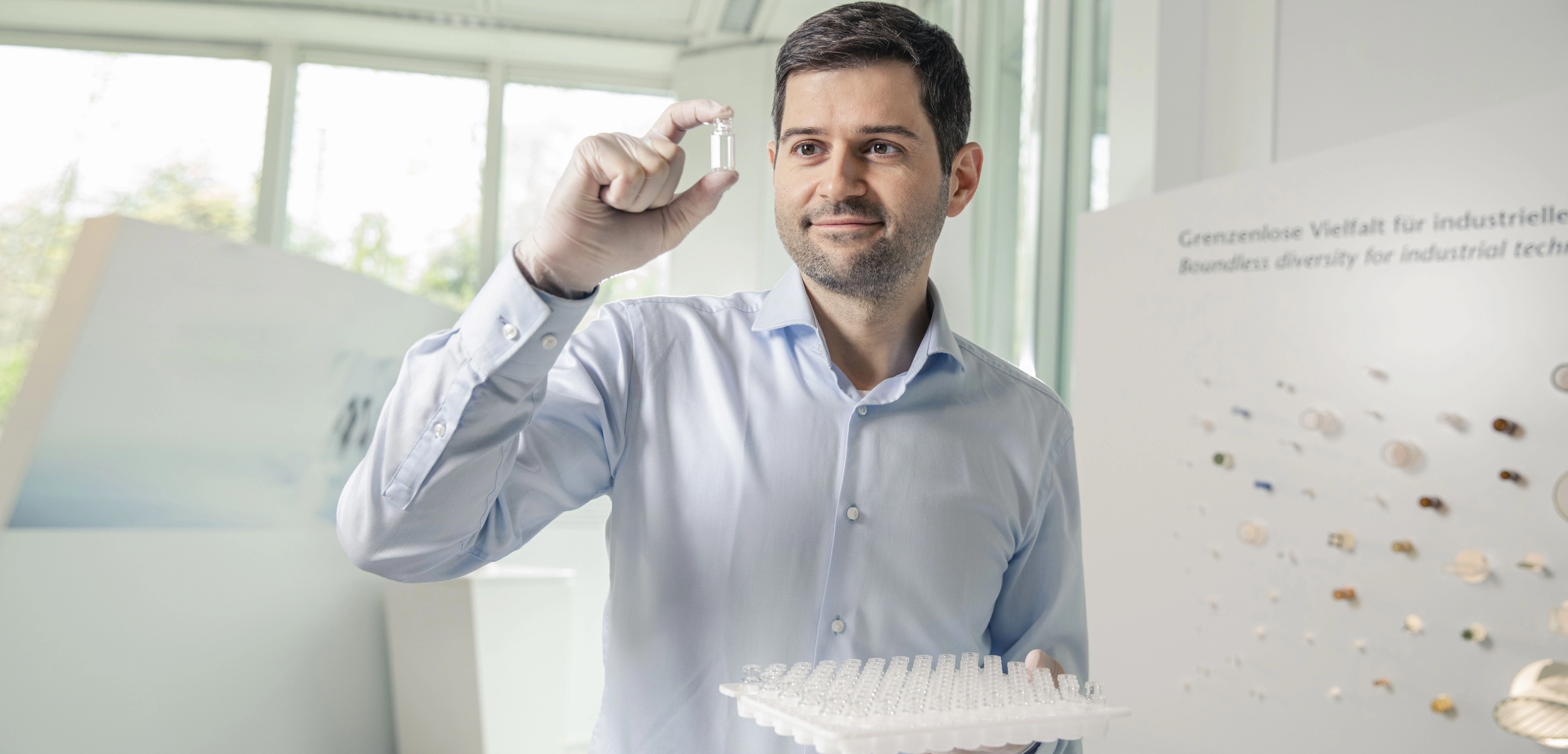 Men looking at sterile vial in hand