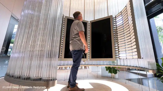 Man standing looking at the glass installation in the Google Store in New York