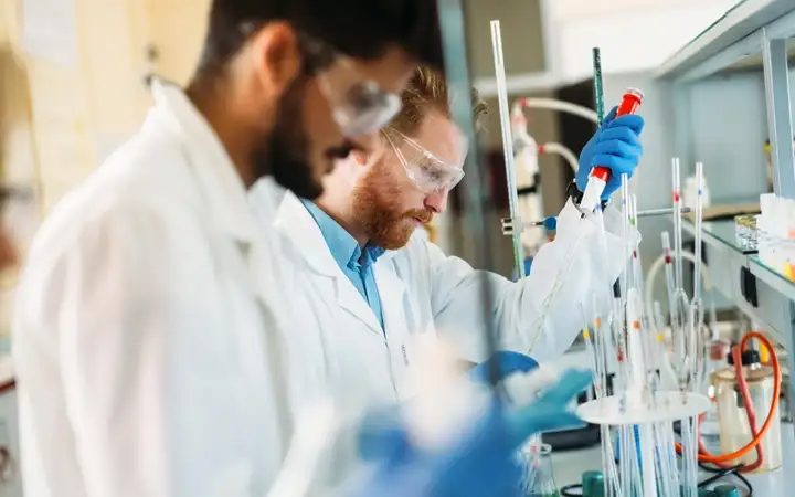 Young male scientists working in a university teaching laboratory