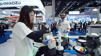 Scientist measuring liquid into a test tube