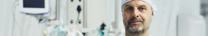 Medical professional in a hospital surrounded by equipment