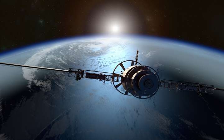Satellite orbiting Earth representing SCHOTT’s hermetic packaging for space electronics