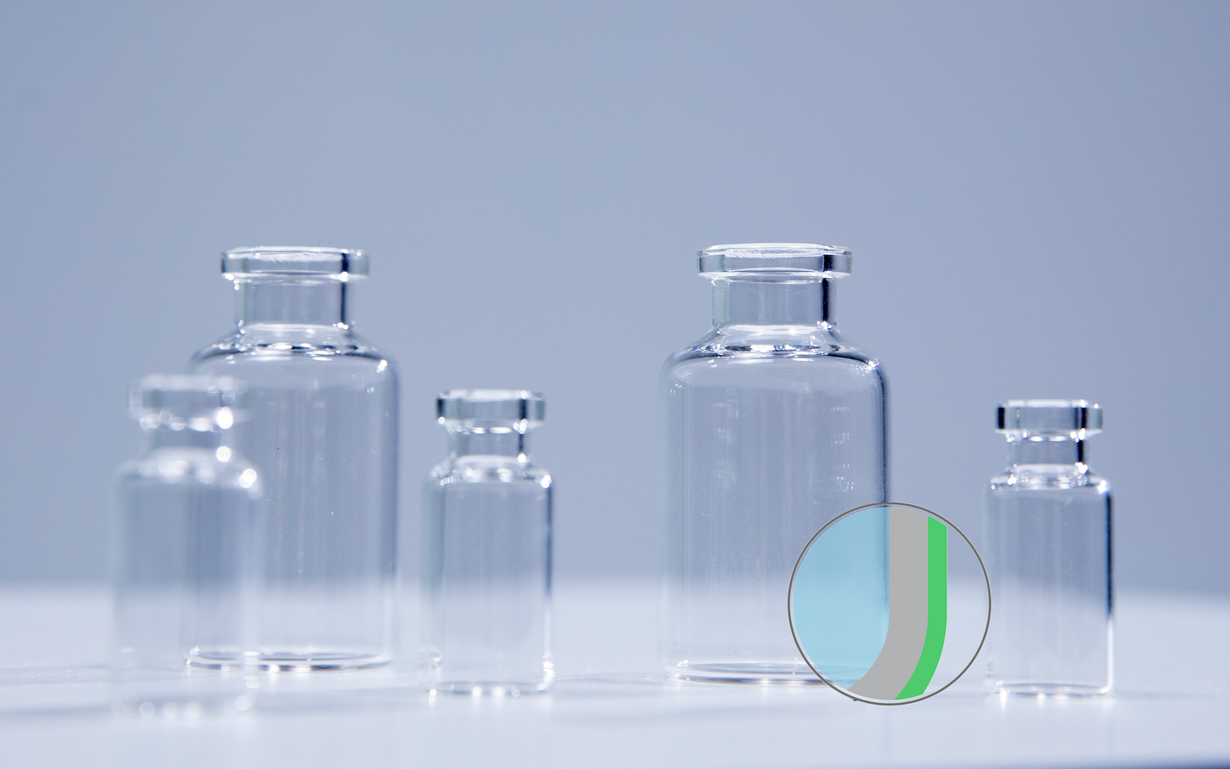 Multiple vials are lined up with one vial featuring an animation highlighting the outer coating. 