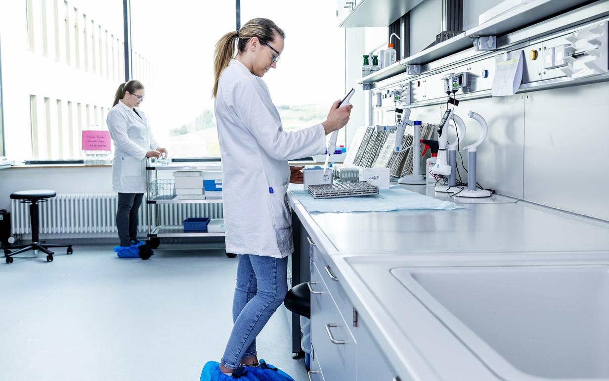 Woman in white coat in the laboratory during a lab test.