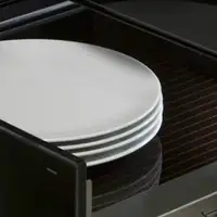 Open kitchen warming drawer with white plates