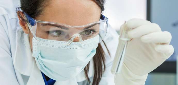 Female Research Scientist with test tube in the laboratory