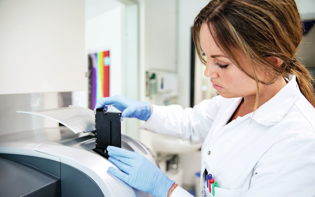Scientist checks a sample in laboratory equipment