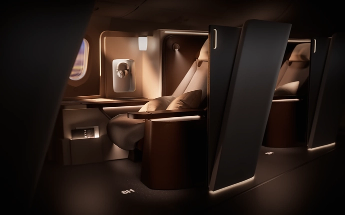 Luxurious airplane cabin with reclining seats and warm ambient lighting