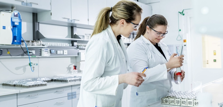 Two women standing in the lab