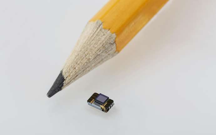 Pencil tip next to an NR600 retinal implant 
