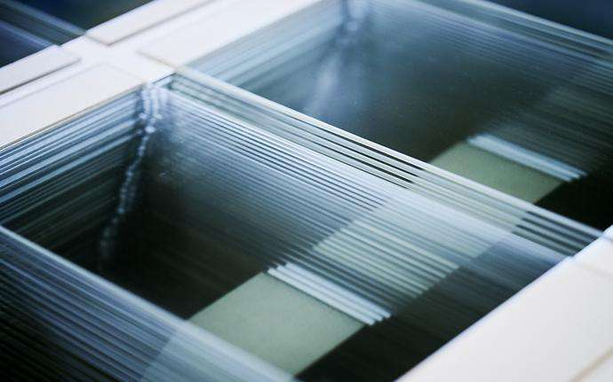 Stacked transparent glass-ceramic panels ready for packaging