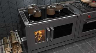 Modern wood cook stove with pans on cooktop above roaring fire