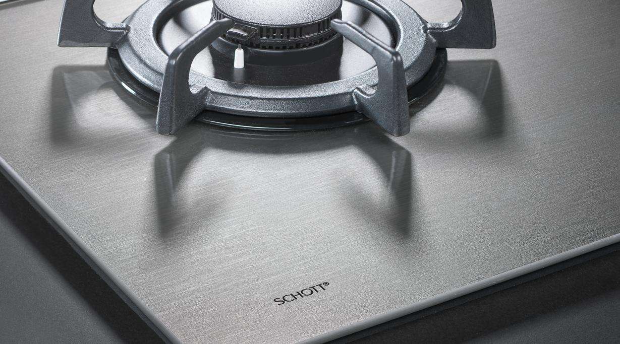 Close up view of a silver gas hob with SCHOTT MetalLook finish