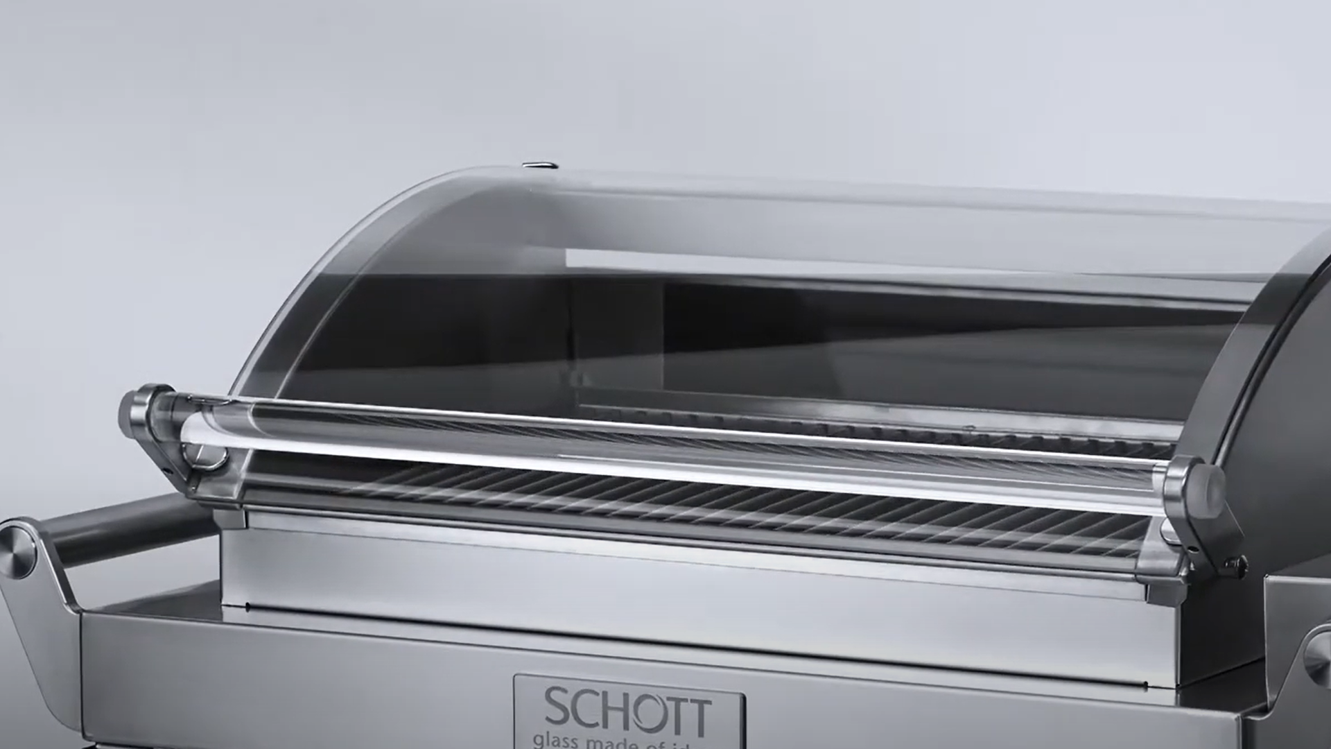 Silver grill with SCHOTT NEXTREMA® glass-ceramic viewing panel