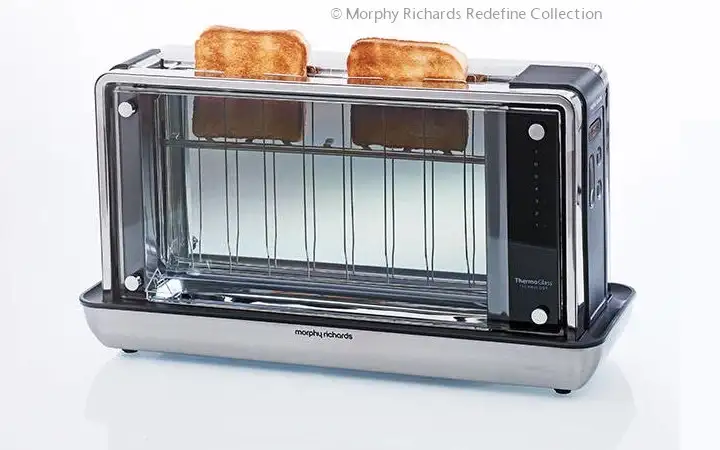 Toaster with clear glass side panels showing two pieces of toast