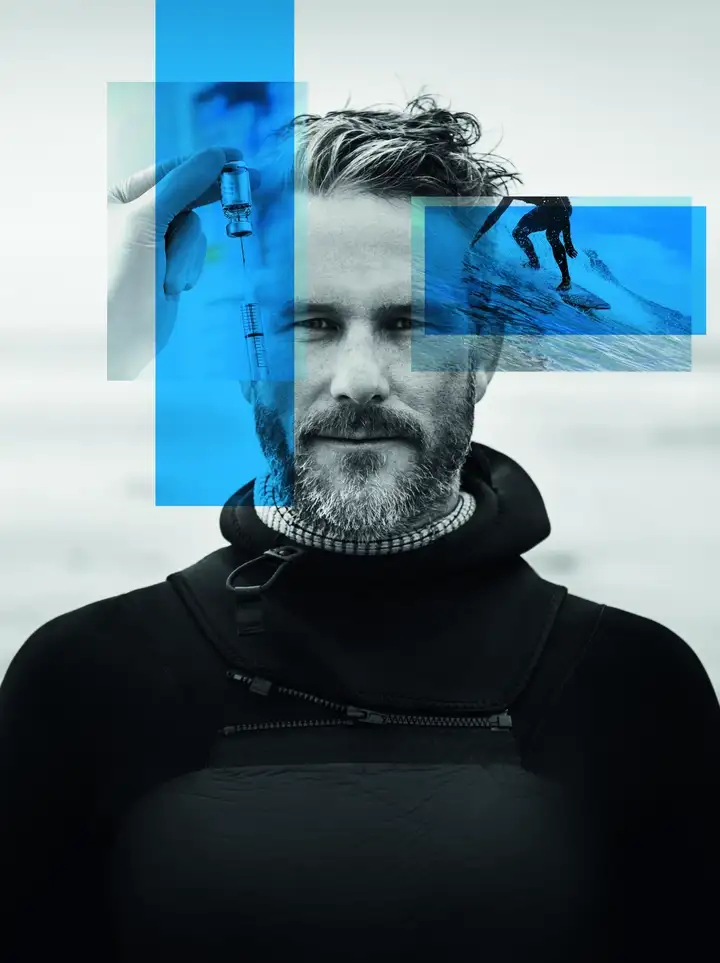 Black and white image of man in black top with blue rectangles